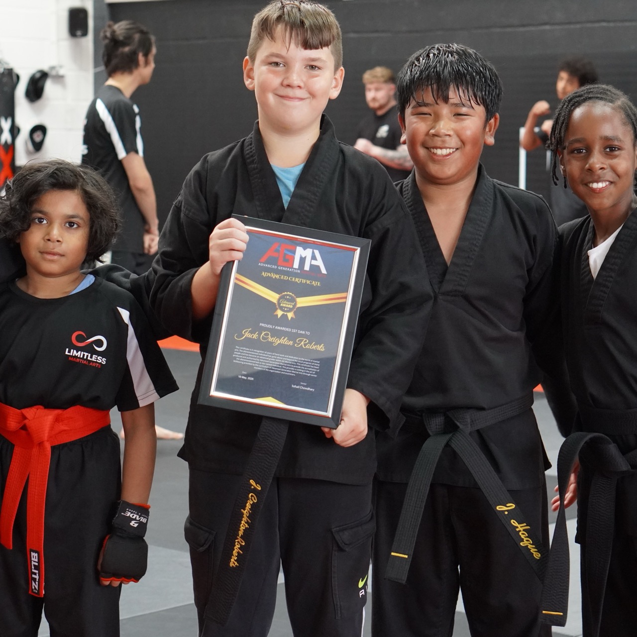 AG Martial Arts students celebrating achievements with certificates